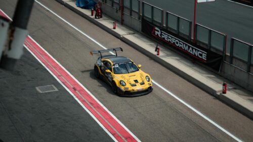 Yellow Porsche 911 GT3 Race Car on Circuit Track 4K Wallpaper