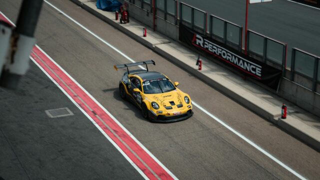 Yellow Porsche 911 GT3 Race Car on Circuit Track 4K Wallpaper