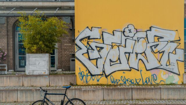 Urban Street Art Graffiti on Yellow Wall Desktop Wallpaper