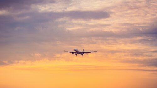 Stunning Airplane Landing at Golden Sunset 4K Desktop Wallpaper