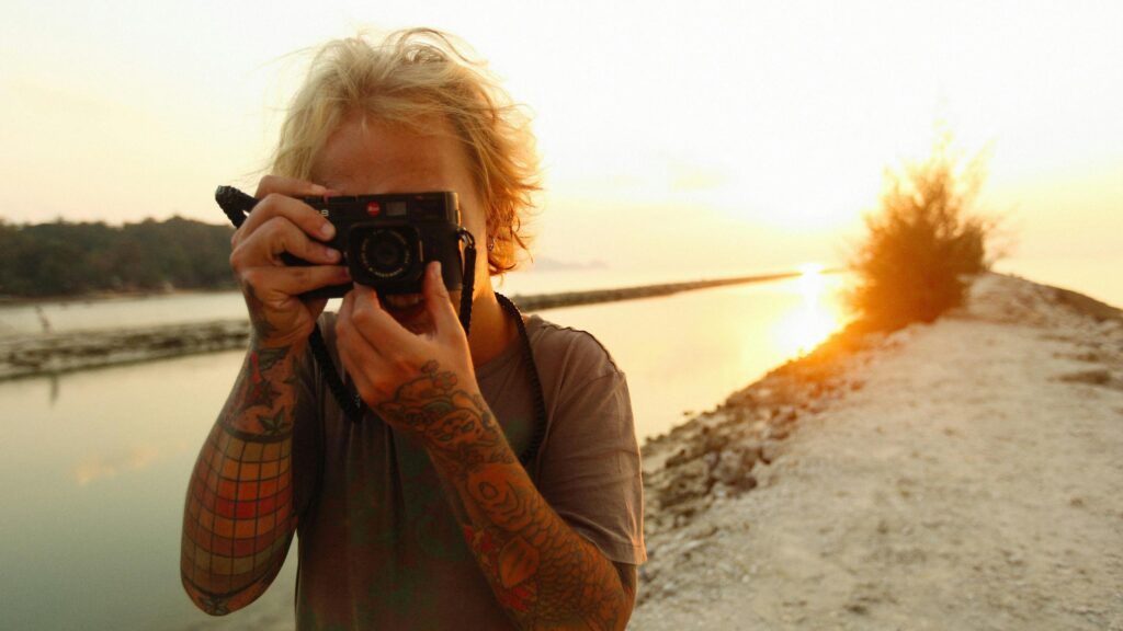 Golden Hour Photographer with Tattoos Desktop Wallpaper