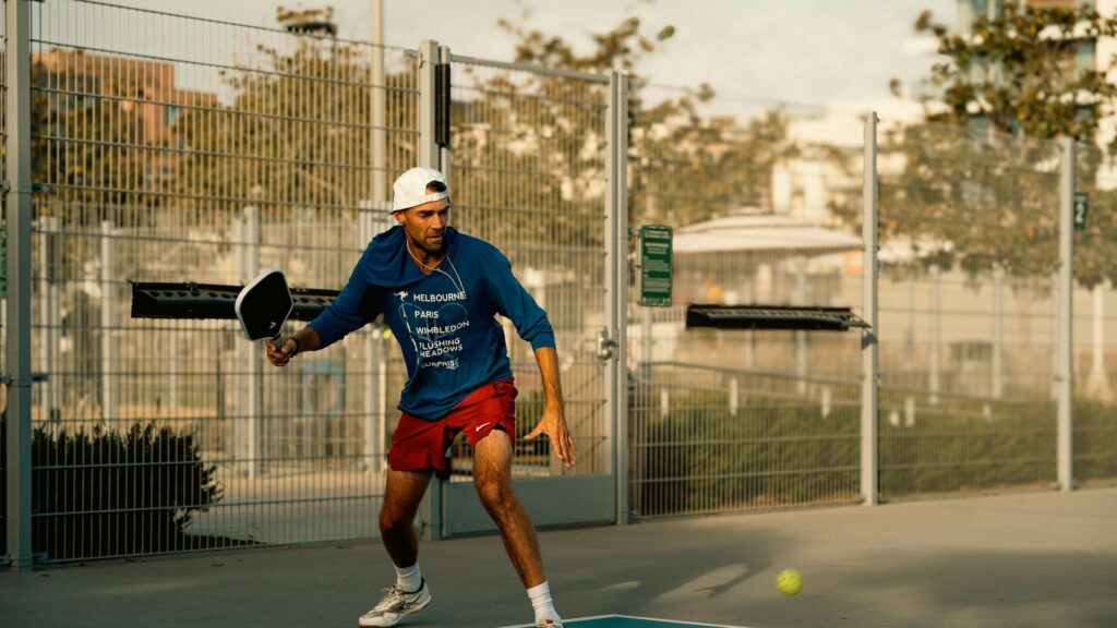 Man Playing Pickleball on Outdoor Court Action 4K Wallpaper