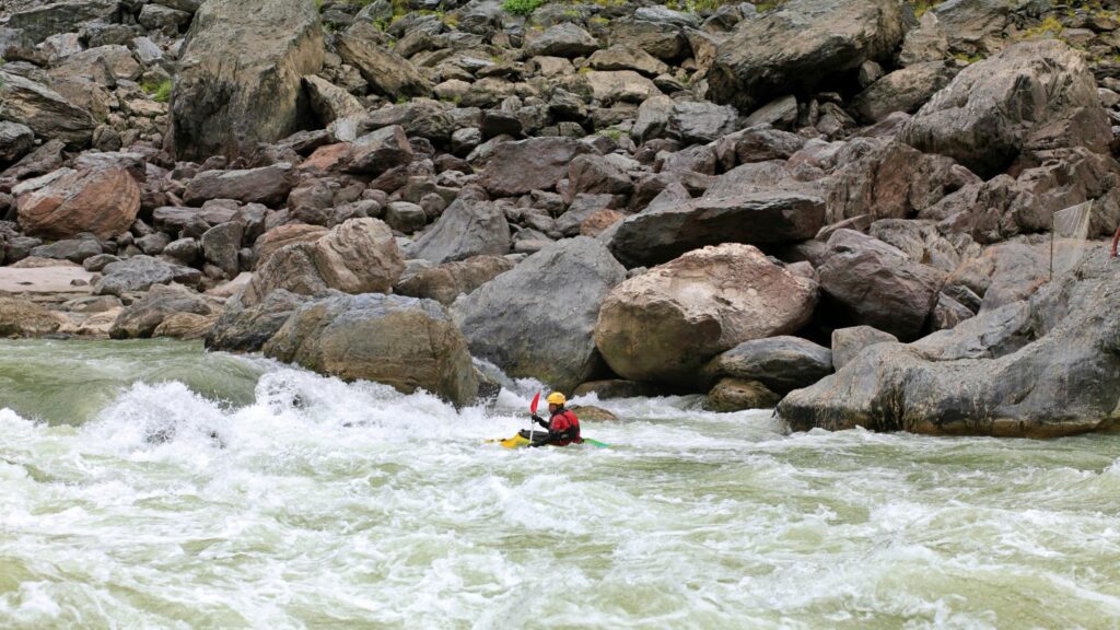 Kayaker Navigating Whitewater River Rapids PC Wallpaper