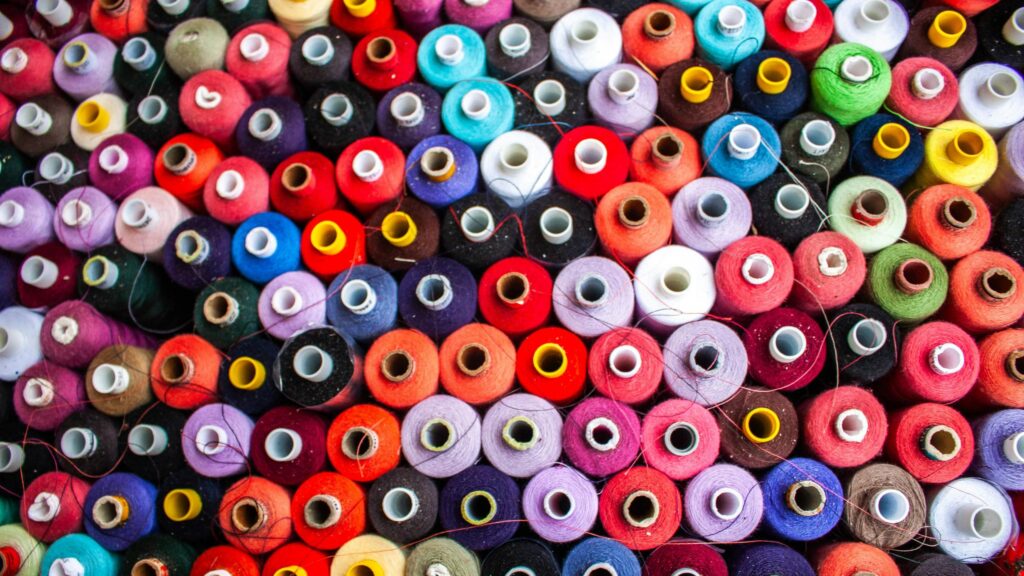 Colorful Spools of Sewing Thread Collection 4K Desktop Wallpaper