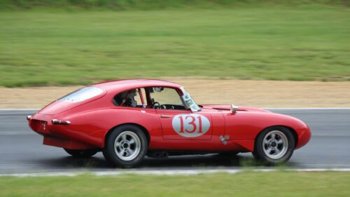 Classic Red Jaguar E-Type Racing Car on Track Desktop Wallpaper