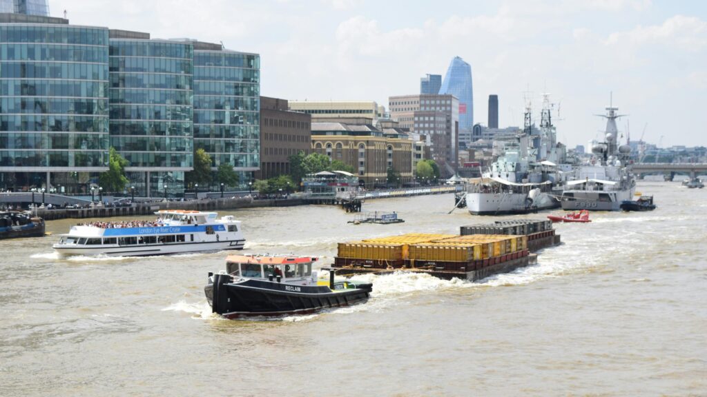 River Thames Boat Traffic and London Skyline 4K Desktop Wallpaper