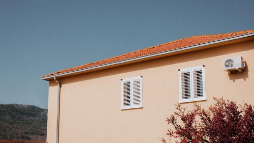 Minimalist Mediterranean House Exterior with Red Tiled Roof Desktop Wallpaper