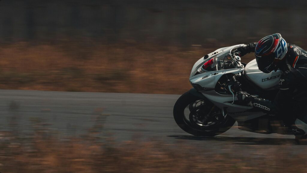 Triumph Daytona Sportbike Racing at High Speed Desktop Wallpaper