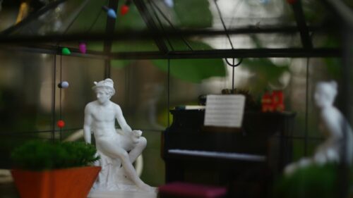 Miniature Classical Statue and Piano in Glass Terrarium Desktop Wallpaper