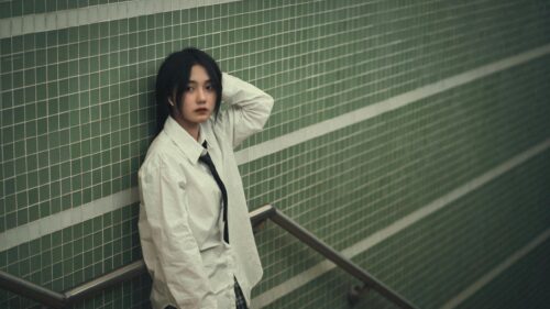 Asian Girl in White Shirt and Tie by Green Tiled Wall Desktop Wallpaper