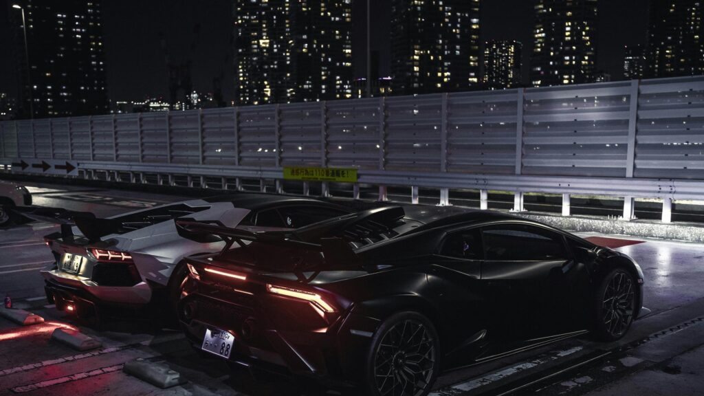 Black and Silver Lamborghini Supercars at Night Parking Lot 4K Wallpaper