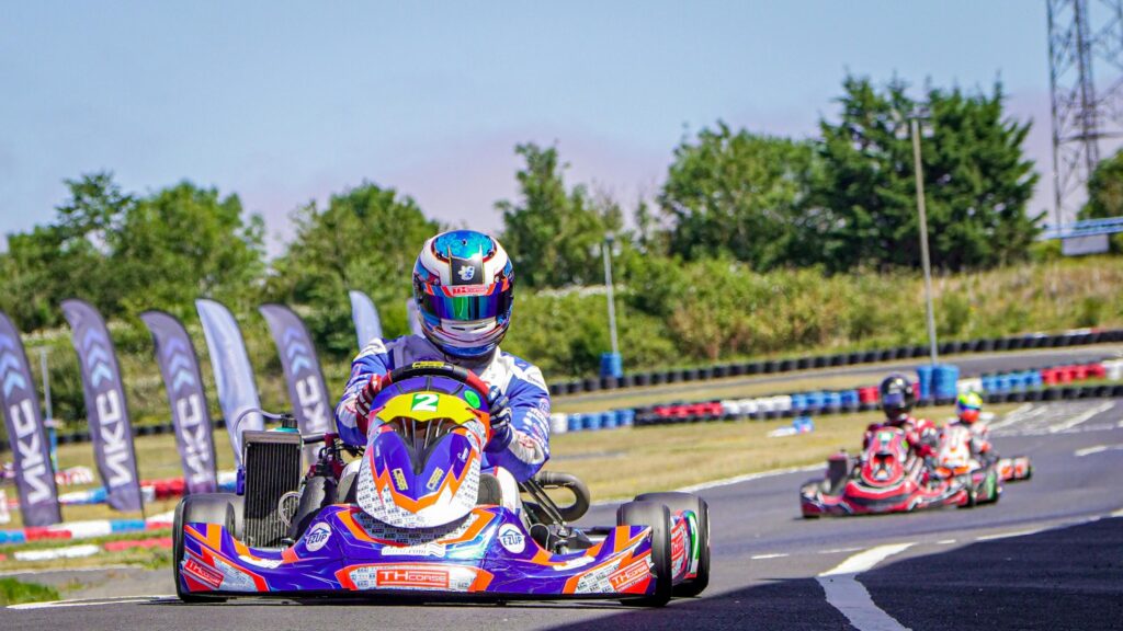 Professional Kart Racing Driver in Action 4K Desktop Wallpaper