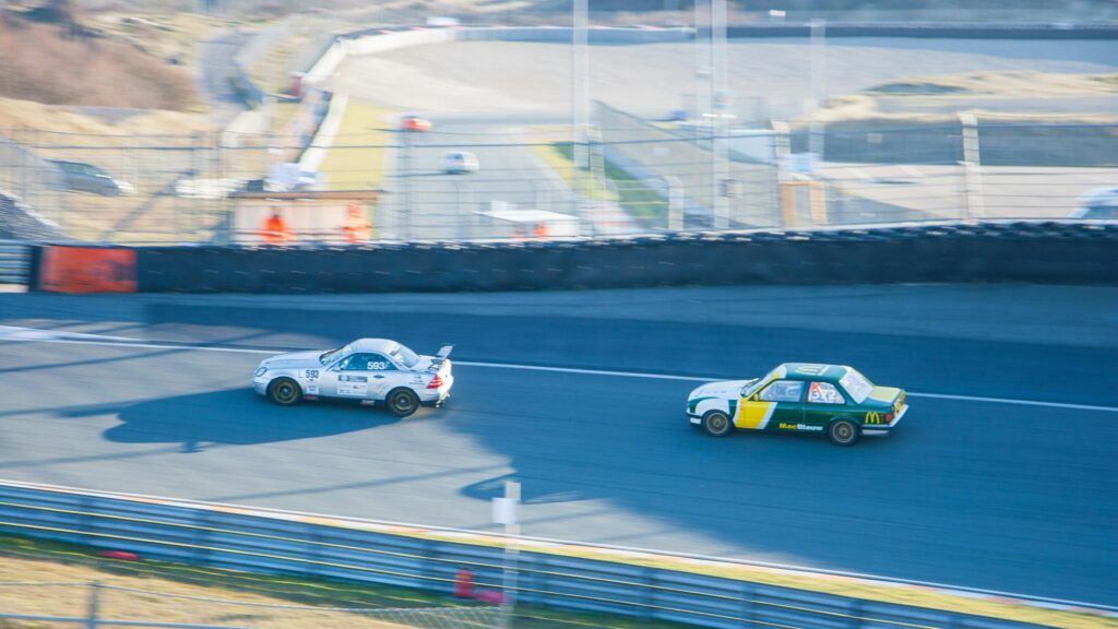 Racing Cars Speeding on Zandvoort Circuit 4K Desktop Wallpaper