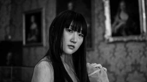 Stunning Portrait of an East Asian Woman in Classic Gallery 4K Wallpaper
