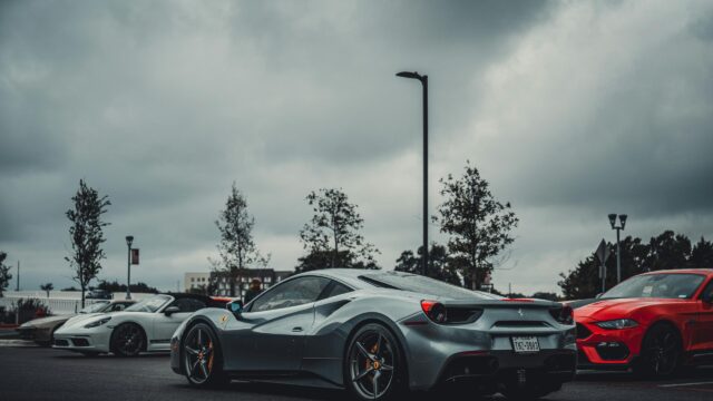 Stunning Silver Ferrari 488 Supercar in Rainy Parking Lot 4K Wallpaper