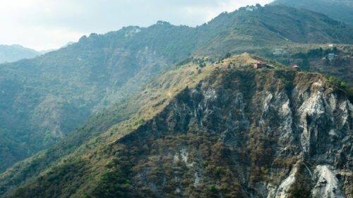 Himalayan Mountain Ridge with Red Roof Cottages 4K Wallpaper