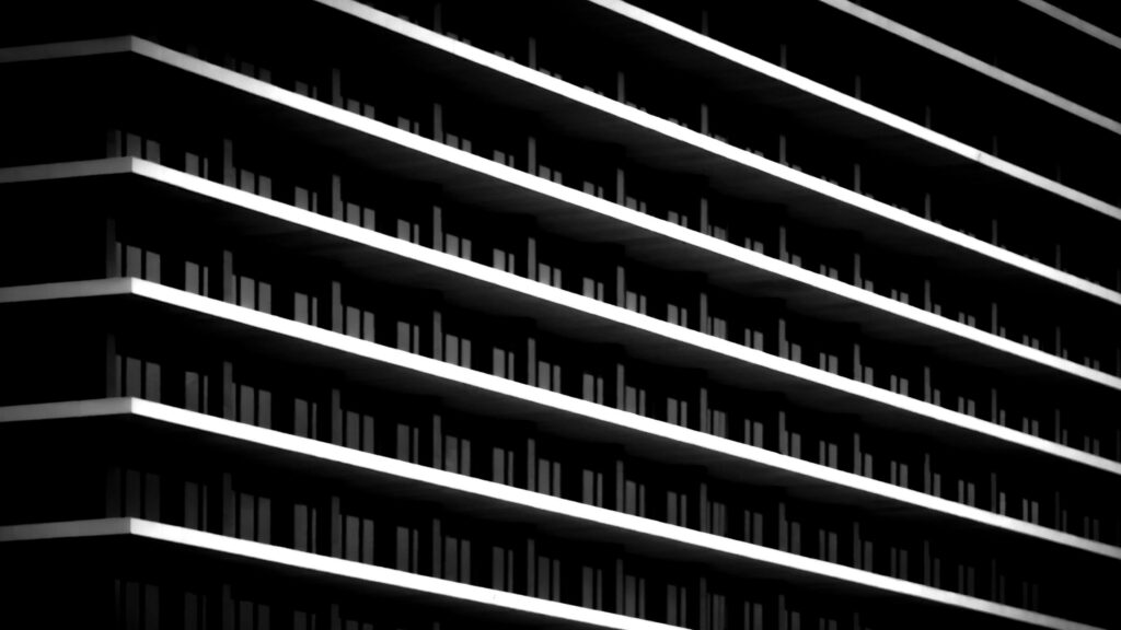 Minimalist Architectural Skyscraper Facade in Black and White Desktop Wallpaper