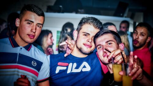Friends Having Fun at a Vibrant Nightlife Party Desktop Wallpaper