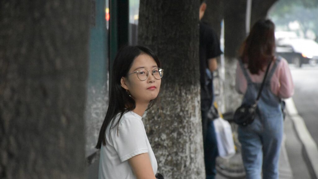 Beautiful Asian Girl with Glasses Looking at Camera Desktop Wallpaper