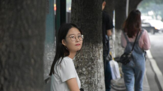Beautiful Asian Girl with Glasses Looking at Camera Desktop Wallpaper