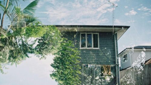 Dreamy Double Exposure House with Palm Trees 4K Wallpaper