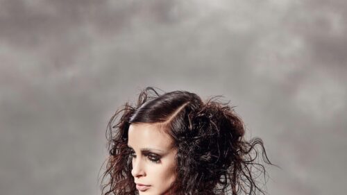 Stylish Brunette Woman with Textured Messy Hair 4K Desktop Wallpaper