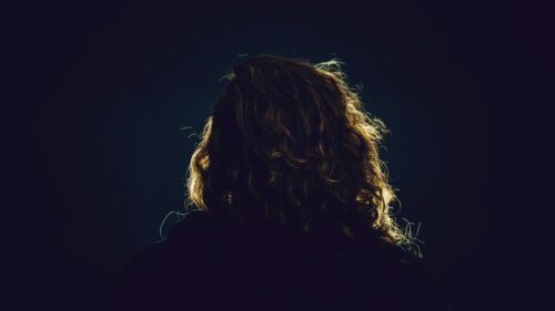 Backlit Woman with Curly Hair Silhouette 4K Desktop Wallpaper