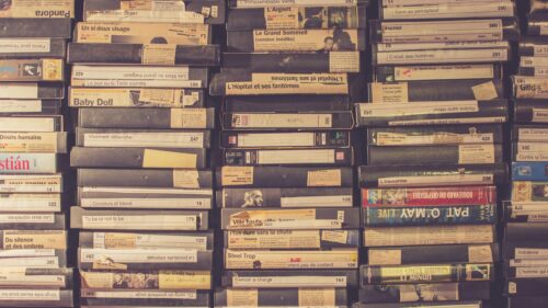 Vintage VHS Movie Cassette Stack 4K Desktop Wallpaper