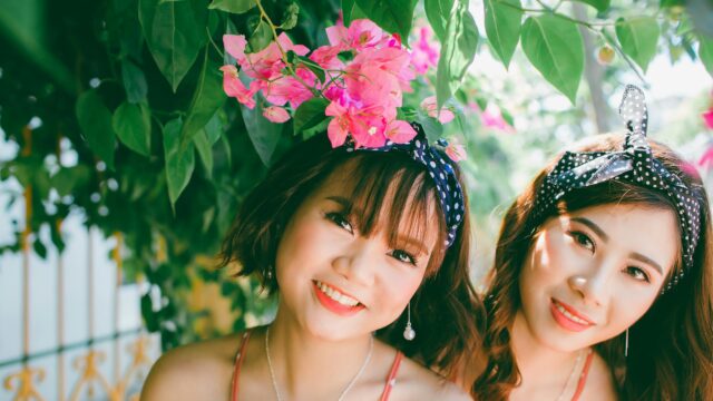 Beautiful Young Women with Pink Flowers Desktop Wallpaper