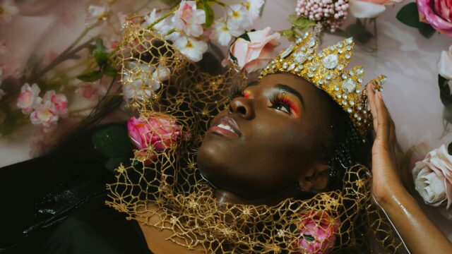 Stunning Black Queen with Golden Crown and Floral Bath Desktop Wallpaper