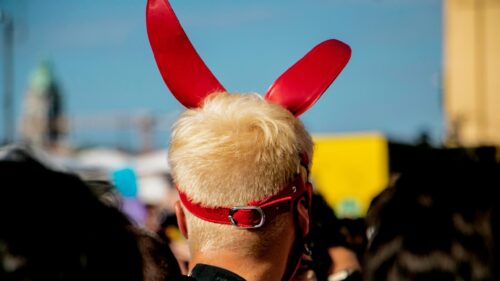 Person Wearing Red Devil Horns and Leather Harness 4K Wallpaper