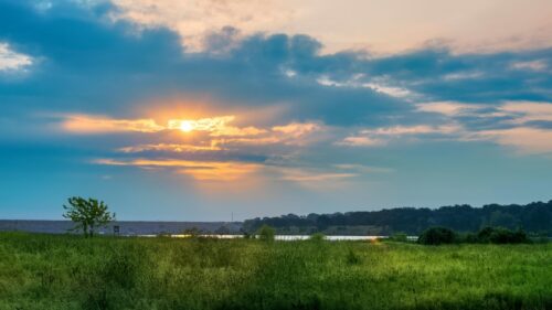 Golden Hour Sunset Over Serene Meadow and Lake Landscape Desktop Wallpaper