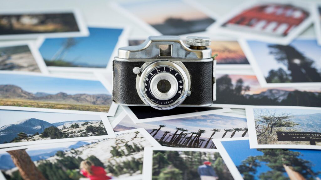 Vintage Elite Camera Surrounded by Travel Memories 4K Wallpaper