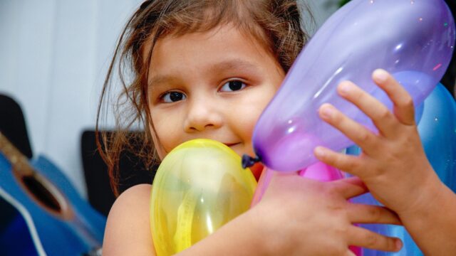 Cute Little Girl Hugging Colorful Balloons High Resolution Desktop Wallpaper