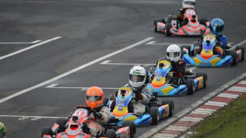 Kart Racing Action on the Track Desktop Wallpaper