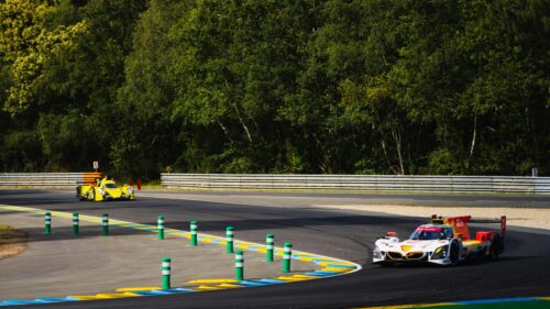 High-Speed Le Mans Prototype Race Cars on Track Desktop Wallpaper