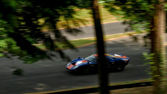 Ford GT40 Race Car Speeding on Track 4K Desktop Wallpaper