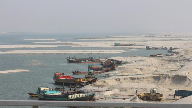 Colorful Sand Dredging Boats on Riverine Landscape Desktop Wallpaper