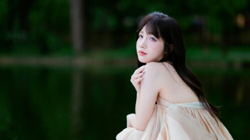 Beautiful Young Woman in Ethereal Cream Dress by Lake Desktop Wallpaper
