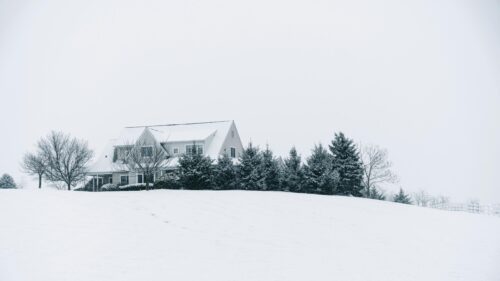 Serene Snow Covered House on a Hill 4K Desktop Wallpaper