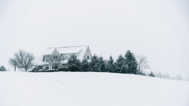 Serene Snow Covered House on a Hill 4K Desktop Wallpaper