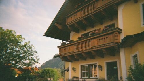 Charming Alpine Wooden Balcony House Scenic View Desktop Wallpaper