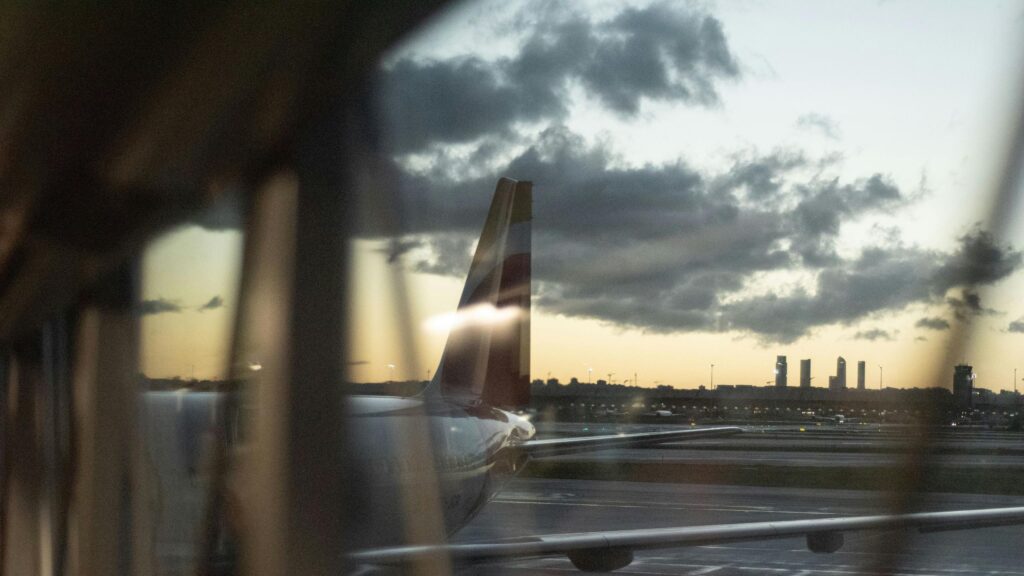 Iberia Airplane Tail at Sunset Airport Runway 4K Wallpaper