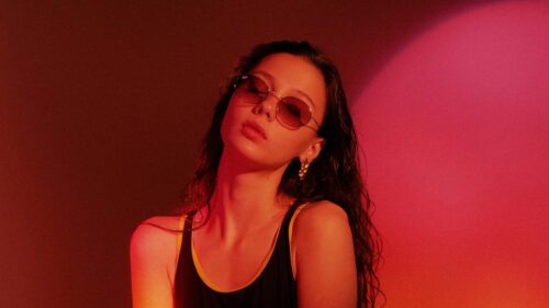 Stylish Girl in Retro Red Lighting Cinematic Portrait 4K Wallpaper