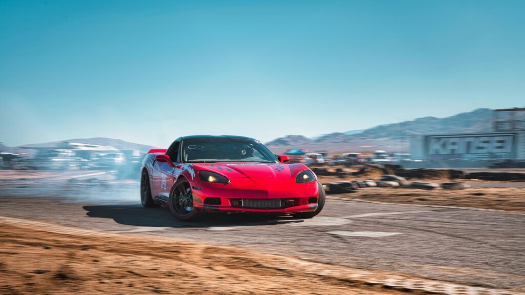 Red Chevrolet Corvette C6 Drifting on Track 4K Wallpaper
