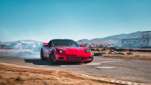 Red Chevrolet Corvette C6 Drifting on Track 4K Wallpaper