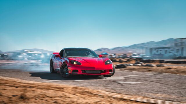 Red Chevrolet Corvette C6 Drifting on Track 4K Wallpaper