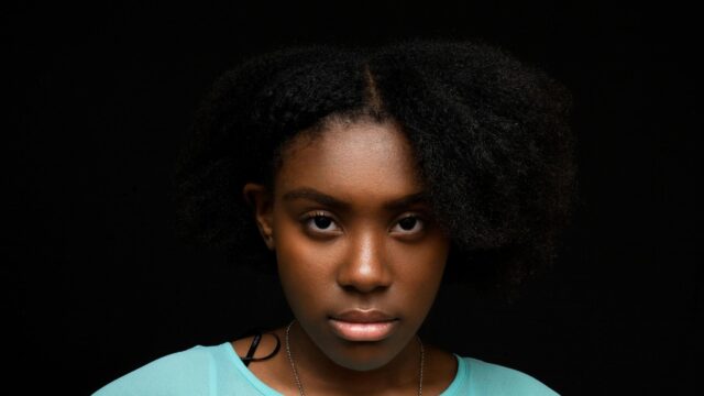Portrait of Young Woman with Natural Textured Hair Desktop Wallpaper