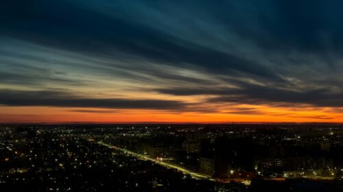 Breathtaking City Sunset Skyline Over Urban Lights 4K Wallpaper