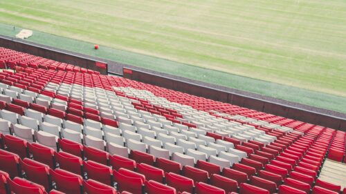 Empty Stadium Red and White Seating Pattern 4K Wallpaper